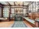 Elegant living room featuring detailed woodwork, a marble fireplace, and natural light, creating a cozy atmosphere at 1000 N Logan St, Denver, CO 80203