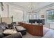 Office featuring a large desk, sitting area, and decorative details, including a chandelier at 1000 N Logan St, Denver, CO 80203