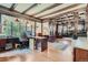 Spacious office with beamed ceilings, hardwood floors, and large windows at 1000 N Logan St, Denver, CO 80203