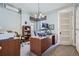 Bright office space with dual desks, shelving, and natural light from the windows at 1000 N Logan St, Denver, CO 80203