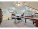 Bright office space with a sloped ceiling, multiple work areas, and a neutral color palette at 1000 N Logan St, Denver, CO 80203