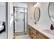 Spa-like bathroom with a walk-in shower and double vanity at 11728 Octave Ave, Lone Tree, CO 80134