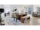 Bright dining area with rustic wooden table and modern chairs at 11728 Octave Ave, Lone Tree, CO 80134