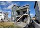 Two-story house with deck and stairs leading down to backyard at 11728 Octave Ave, Lone Tree, CO 80134