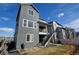 Gray two-story house with backyard and grill at 11728 Octave Ave, Lone Tree, CO 80134