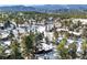 Aerial view of home in snowy mountain setting at 1228 Pomegranate Ln, Golden, CO 80401