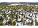 Snow-covered neighborhood with houses surrounded by trees at 1228 Pomegranate Ln, Golden, CO 80401