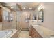 Elegant bathroom with a large shower, soaking tub, and double vanity at 1228 Pomegranate Ln, Golden, CO 80401