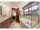 Spa-like bathroom with soaking tub, shower, and modern fixtures at 1228 Pomegranate Ln, Golden, CO 80401