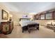 King bedroom with a cozy sitting area and lots of natural light at 1228 Pomegranate Ln, Golden, CO 80401