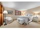 Bedroom with a queen bed and built-in bench at the foot of the bed at 1228 Pomegranate Ln, Golden, CO 80401