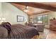 Main bedroom with mountain views and sitting area at 1228 Pomegranate Ln, Golden, CO 80401