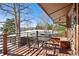 Deck with table and chairs, offering mountain views at 1228 Pomegranate Ln, Golden, CO 80401