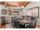 Formal dining room with a large wooden table and black chairs at 1228 Pomegranate Ln, Golden, CO 80401