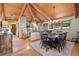 Spacious dining area featuring a rustic wooden table and high ceilings at 1228 Pomegranate Ln, Golden, CO 80401