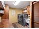 Laundry room with washer, dryer, and extra storage at 1228 Pomegranate Ln, Golden, CO 80401