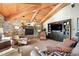 Living room with a stone fireplace and built-in media center at 1228 Pomegranate Ln, Golden, CO 80401