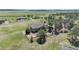 An aerial view showcasing the home's large lot and surrounding natural landscape at 19336 Queens Crescent Way, Monument, CO 80132