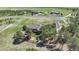Aerial view of the home showcasing the sprawling lot, mature trees, and circular driveway at 19336 Queens Crescent Way, Monument, CO 80132