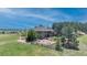 Aerial view of a large home with a big backyard and seating, surrounded by nature at 19336 Queens Crescent Way, Monument, CO 80132