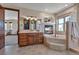 Well-appointed bathroom with a soaking tub, fireplace, and vanity, creating a relaxing spa-like retreat at 19336 Queens Crescent Way, Monument, CO 80132