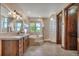 Spacious bathroom with a soaking tub, glass block shower, and double sink vanity, offering a luxurious feel at 19336 Queens Crescent Way, Monument, CO 80132