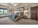 Comfortable bedroom featuring a bed, window, and a door at 19336 Queens Crescent Way, Monument, CO 80132