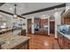 Gourmet kitchen featuring granite countertops, stainless steel appliances, and custom cabinetry at 19336 Queens Crescent Way, Monument, CO 80132
