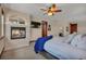 Cozy main bedroom features a fireplace, television, and neutral color palette at 19336 Queens Crescent Way, Monument, CO 80132