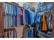 Organized walk-in closet with ample hanging space and shelving, providing efficient storage solutions at 19336 Queens Crescent Way, Monument, CO 80132