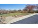 Large grassy backyard with a mature tree and ample space for outdoor activities at 6087 W 84Th Ave, Arvada, CO 80003
