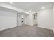 Spacious basement with neutral walls and carpeting, offering many possibilities at 6087 W 84Th Ave, Arvada, CO 80003
