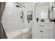 Modern bathroom featuring white tile shower, new vanity, and modern finishes at 6087 W 84Th Ave, Arvada, CO 80003