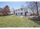 Spacious white home featuring an open backyard with stone landscaping at 6087 W 84Th Ave, Arvada, CO 80003