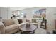 Inviting living room with view to the backyard, light paint and modern decor at 6087 W 84Th Ave, Arvada, CO 80003