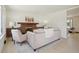 Inviting living room with brick fireplace, neutral decor, and light paint at 6087 W 84Th Ave, Arvada, CO 80003