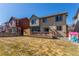 Expansive backyard with a deck, perfect for entertaining, and plenty of room for outdoor activities at 10438 Olathe Way, Commerce City, CO 80022