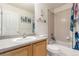 Bathroom features an oak vanity, and a shower and tub combination at 10438 Olathe Way, Commerce City, CO 80022