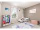 A fun, decorated bedroom featuring a rainbow rug and white furniture at 10438 Olathe Way, Commerce City, CO 80022