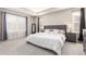 The main bedroom offers a large window, tray ceiling, and soft neutral colors at 10438 Olathe Way, Commerce City, CO 80022