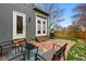 Backyard patio with stone pavers, a grill, outdoor seating, and a view of the fenced yard and landscaping at 3105 Galileo Ln, Boulder, CO 80301