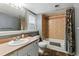 Bathroom featuring a bathtub with shower, single sink vanity, and neutral tones at 3105 Galileo Ln, Boulder, CO 80301