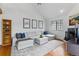 Spacious living room with hardwood floors, comfortable seating, and a fireplace, perfect for gatherings at 3105 Galileo Ln, Boulder, CO 80301