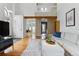 Spacious living room with a large sectional sofa, hardwood floors, and open access to the kitchen and dining area at 3105 Galileo Ln, Boulder, CO 80301