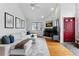 Cozy living room featuring a fireplace, hardwood floors, and comfortable seating arrangement at 3105 Galileo Ln, Boulder, CO 80301
