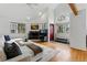 Open living area with a fireplace, hardwood floors, and natural light and bench seating at 3105 Galileo Ln, Boulder, CO 80301
