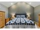 Comfortable bedroom with neutral walls, vaulted ceiling, a patterned quilt, and recessed lighting at 3105 Galileo Ln, Boulder, CO 80301