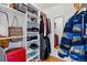 Organized walk-in closet with shelves, hanging rods, mirror, and ample storage space for clothes and accessories at 3105 Galileo Ln, Boulder, CO 80301