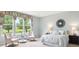 Light-filled bedroom with plush armchairs, bedside tables and neutral decor at 5603 Van Bibber Ct, Golden, CO 80403