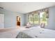 Spacious bedroom showcasing large windows and cozy seating area overlooking backyard at 5603 Van Bibber Ct, Golden, CO 80403